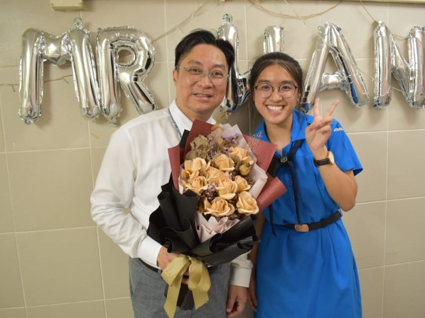 Photo of WAN Kwok Wing with his student.