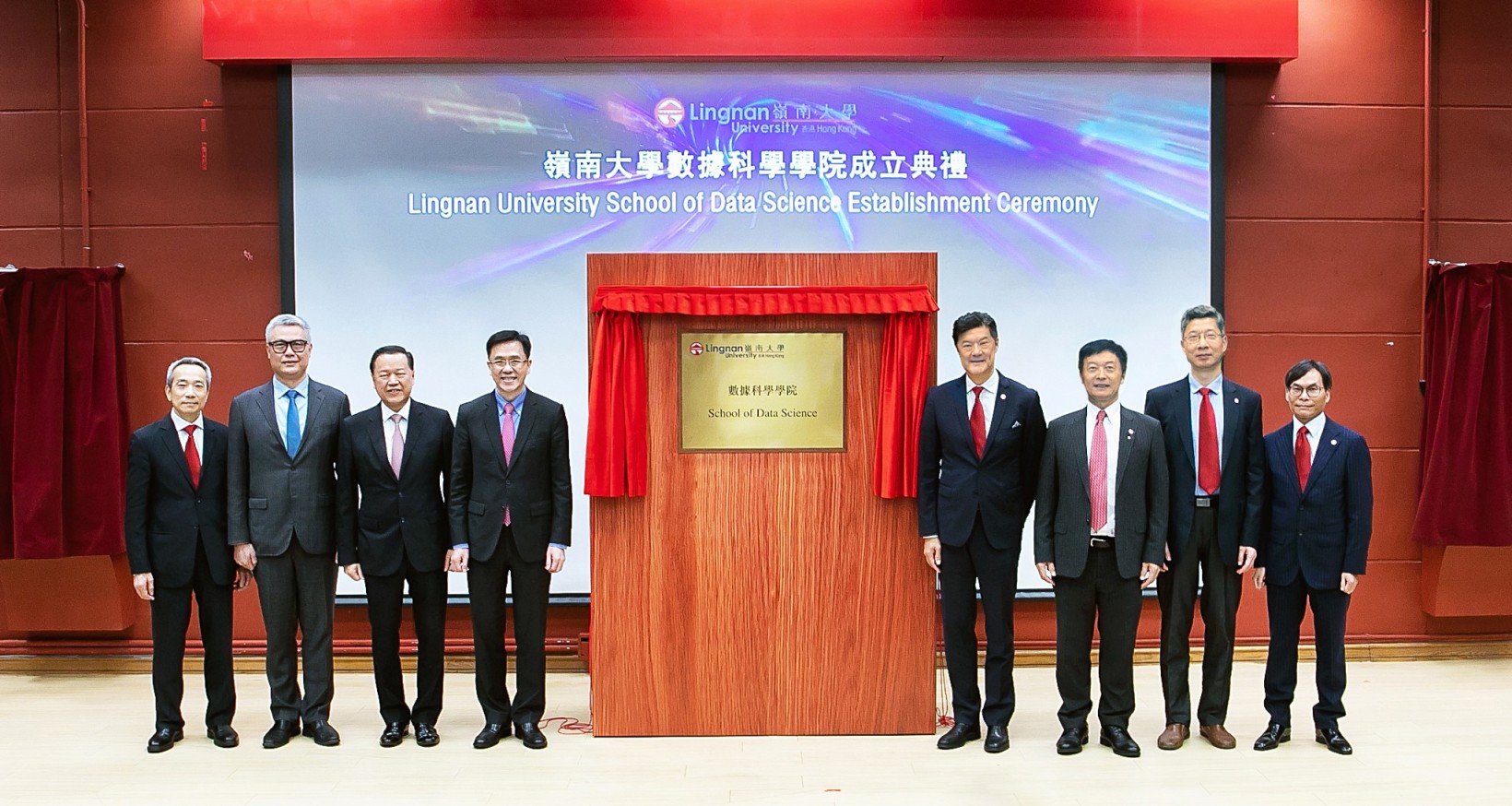 Lingnan University announces the establishment of the School of Data Science. Prof Dong Sun, Secretary for Innovation, Technology and Industry (fourth from left), Mr Tim Lui Tim-leung, Chairman of the University Grants Committee (UGC) (third from left), Dr Rocky Cheng Chung-ngam, CEO of Cyberport (second left), Mr Augustine Lui Ngok-che, Chairman of Lingnan Education Organization (left), Council Chairman Mr Andrew Yao Cho-fai (fourth from right), President Prof S. Joe Qin (third from right), Vice-President (Research and Innovation) Prof Xin Yao (second right), and Acting Dean of the School of Data Science and Associate Vice-President (Strategic Research) Prof Sam Kwong Tak-wu (right) unveil the plaque for the School of Data Science.