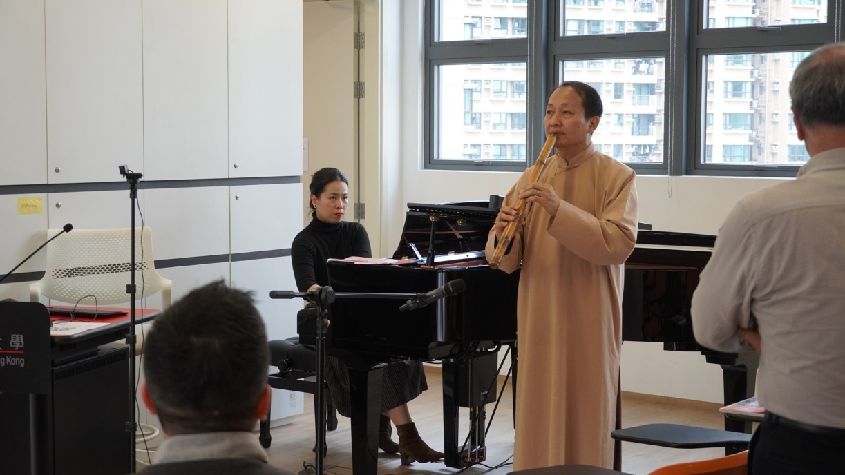Dr Virginia Li Meng, Lecturer at the Confucius Institute of The Hong Kong Polytechnic University, and Mr Wong Wai-ming, Xiao player and maker, performs the Cantonese pop song 'A House Is Not A Home(家變)' together.