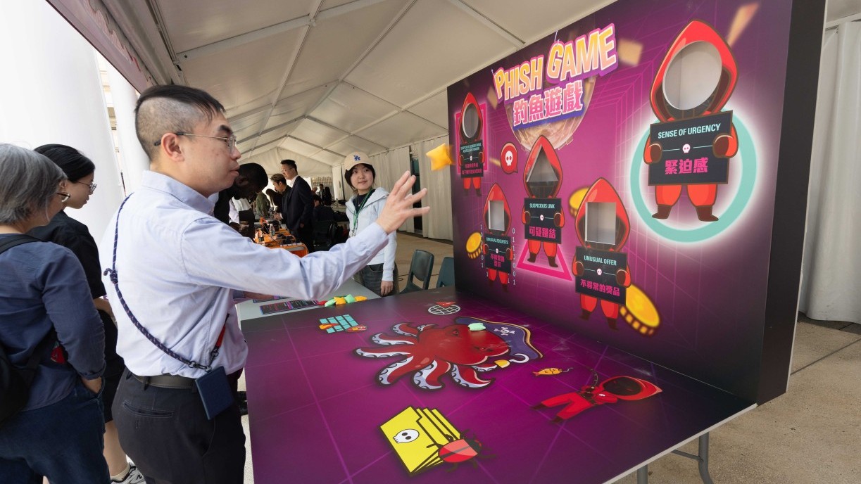 Participants fully engage in the interactive game booths.