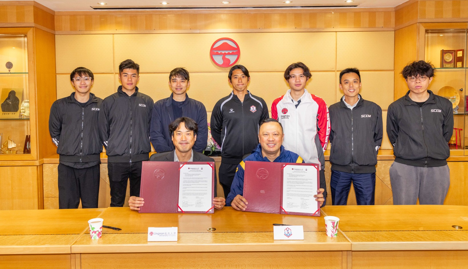 Prof Jonathan Fong (front left), Associate Dean (Administration and Education) of the School of Interdisciplinary Studies, and Ricky Cheng (front right), Technical Director of Southern District Football Club sign the Memorandum of Understanding to launch a three-year collaboration focused on advancing sports education and community engagement.