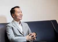 Applying economics to his leading role: Prof Larry Qiu Dongxiao