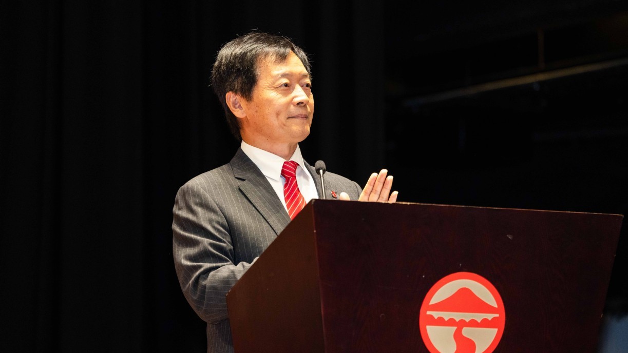President S. Joe Qin delivers a speech.