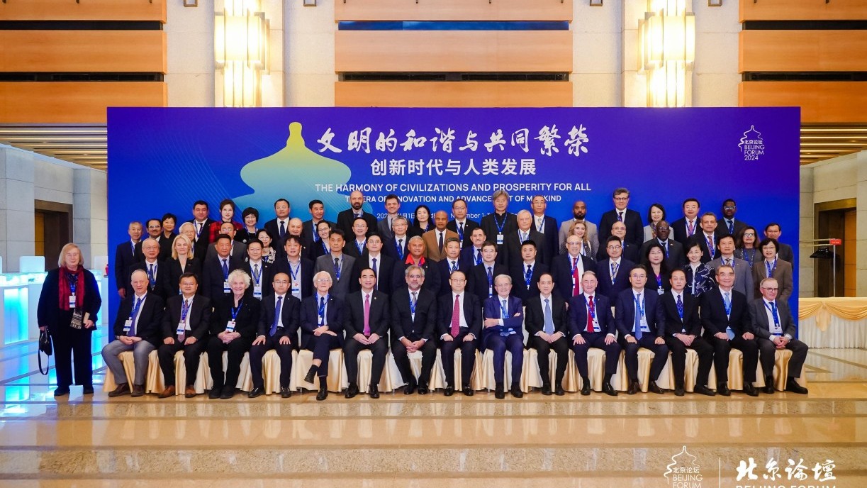 Prof S. Joe Qin (second right, second row), President and Wai Kee Kau Chair Professor of Data Science, and Prof Li Dong-hui (right, second row), Associate Vice-President (Experiential Learning Projects) at Lingnan University attend the 21st Beijing Forum.