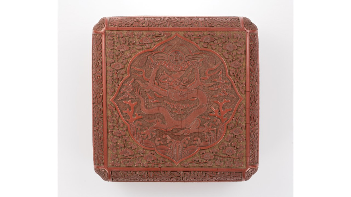 Photo 3. Square carved red yellow-ground lacquer box with dragon and tian xia tai ping characters: Wanli mark cyclically dated yiwei year; Wanli reign, Ming (1595); Lacquer; L 30 cm W 30 cm H 9 cm; Chamber of Young Snow Collection