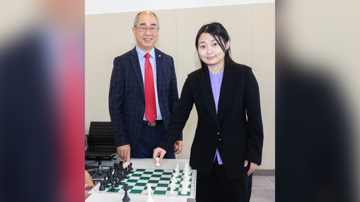 Prof Raymond Chan Hon-fu (left), Vice-President (Academics) cum Provost and Lam Man Tsan Chair Professor of Scientific Computing at Lingnan University, welcomes Ms Ju Wenjun (right) to Hong Kong.
