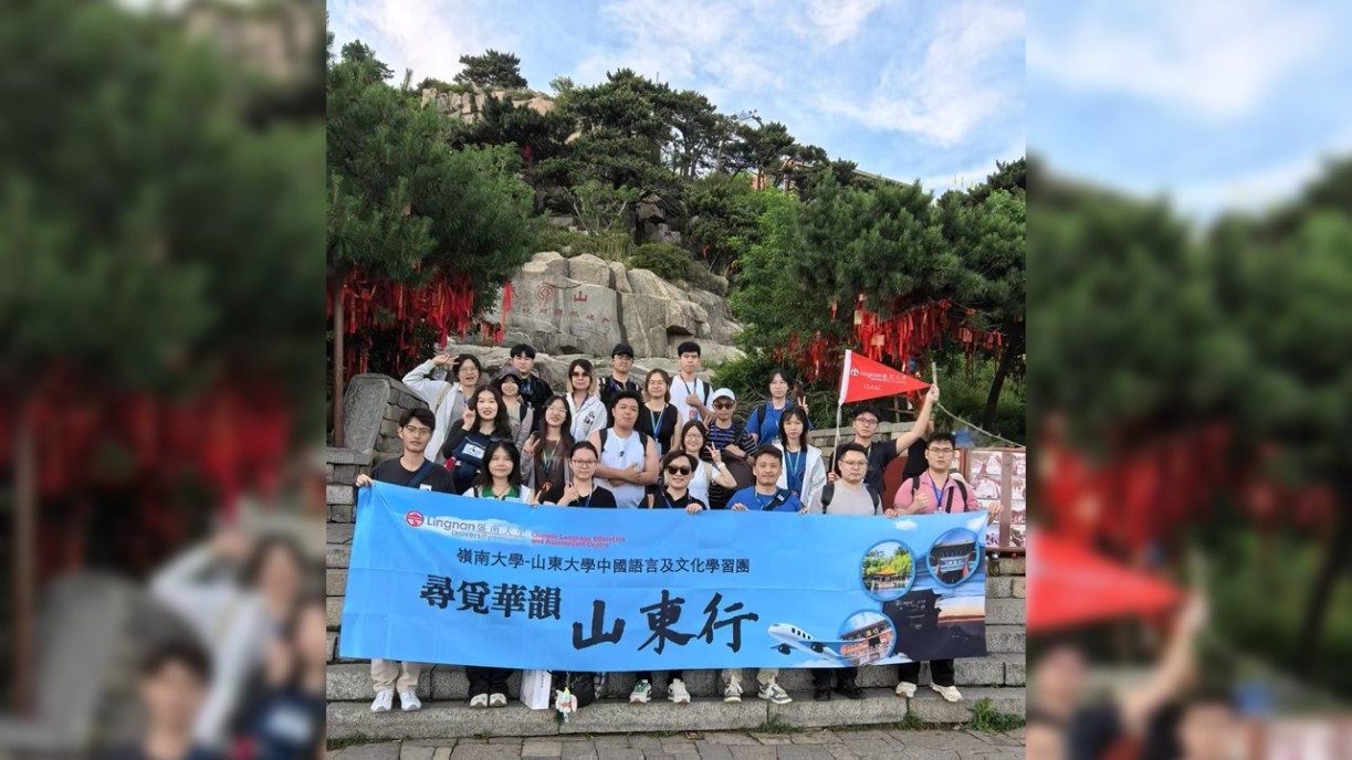 With a banner on Yuhuangding - the Jade Emperor Peak of Mount Tai.