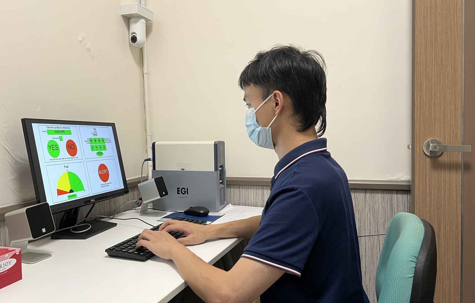Lingnan University study shows that multitasking uses multiple cognitive abilities. A research assistant looks at the tasks used in the study.