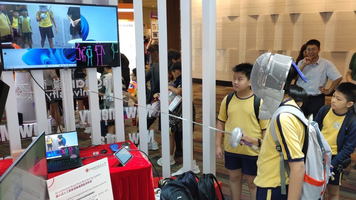 Visitors take part in the AI-based Fencing Training and Assessment System.