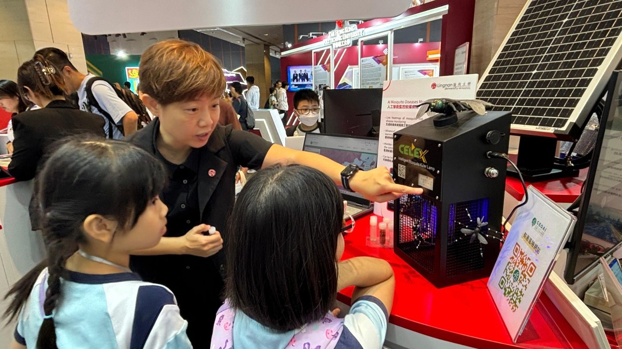 Prof Paulina Wong Pui-yun (middle) shows the AI Mosquito Diseases Control System, displaying various species of mosquitoes recently captured in Hong Kong.