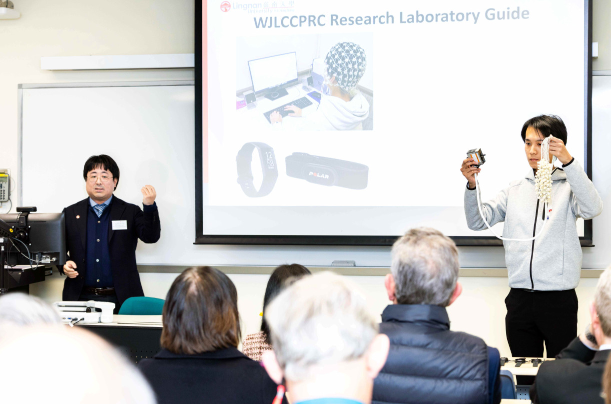 Prof Ng Tin-yan (left) is describing new approaches adopted by the Department of Psychology to integrate neuroscience into psychological research. The flagship Wellness Ambassador Programme, which incorporates technological applications, has been proven to assist participants' physical and mental well-being.