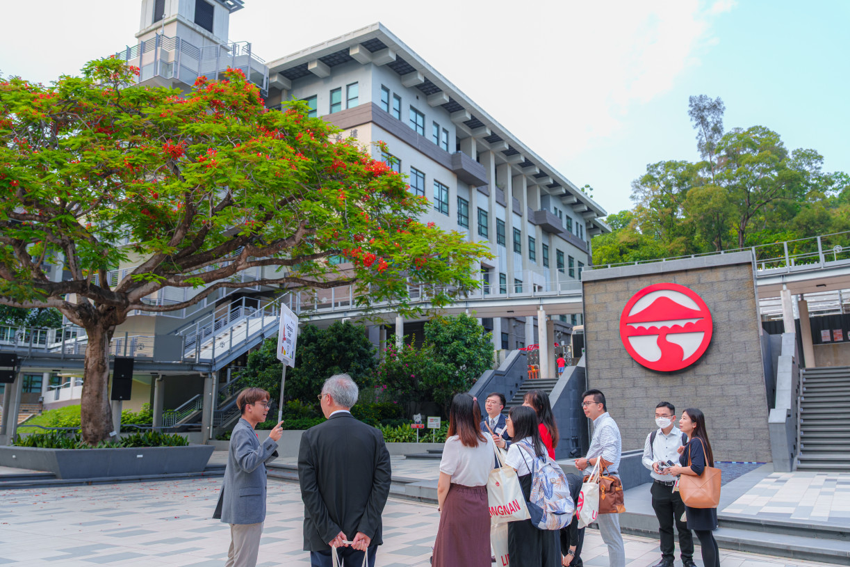 Participants enjoy a guided campus tour in small groups, exploring Lingnan University's vibrant learning environment and state-of-the-art facilities.