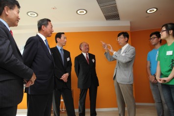 Prof Bernard Lim, Principal of AD+RG Architecture Design and Research Group Ltd leads the officiating guests to tour around the Jockey Club New Hall. 