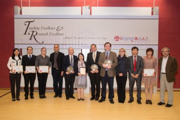 Recipients of the Teaching Excellence Awards and Certificates of Merit take a photo with members of the Presidential Group.