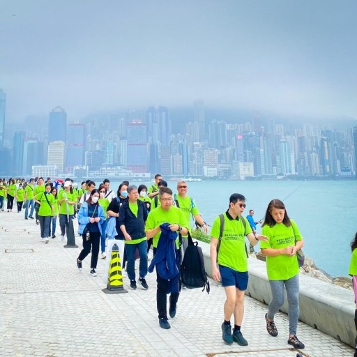 Participants walk along the waterfront promenade in the West Kowloon Cultural District.