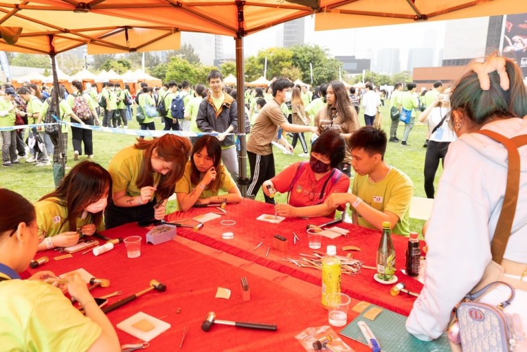 Participants participate in workshops at the funfair.