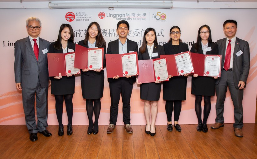 Mr Patrick Wong (1 from the left) and President Leonard K Cheng (1 from the right) present certificates of appointment to the students.
