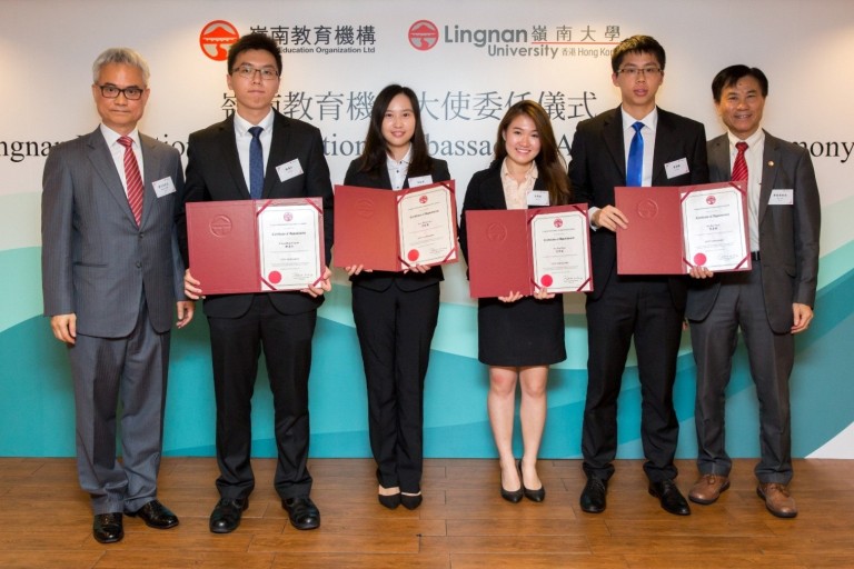 Mr Patrick Wong (1 from the left) and President Leonard K Cheng (1 from the right) present certificates of appointment to the students.