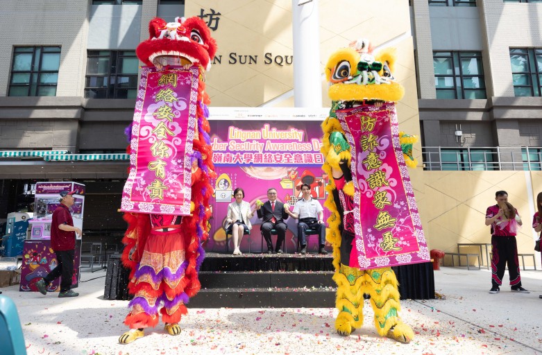 Lion dancers presenting cybersecurity awareness slogans