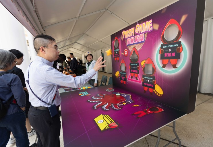Participants at an interactive game booth
