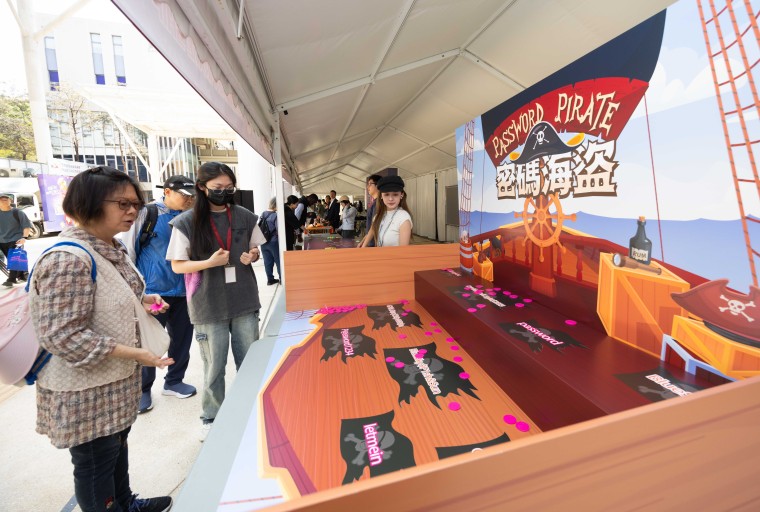 Participants at an interactive game booth