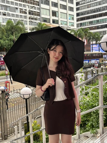 International student from Kazakhstan posing with umbrella in Hong Kong’s Central district