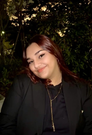 Pakistani student smiling in evening profile photo outdoors
