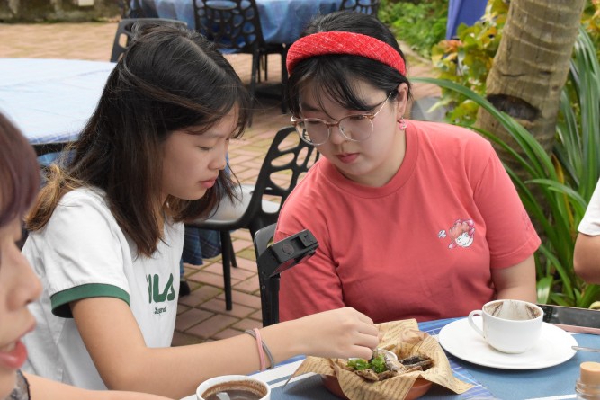 Students were filming a video showcasing Filipino cuisine (Fried Tawilis & Hot Tsokolate).