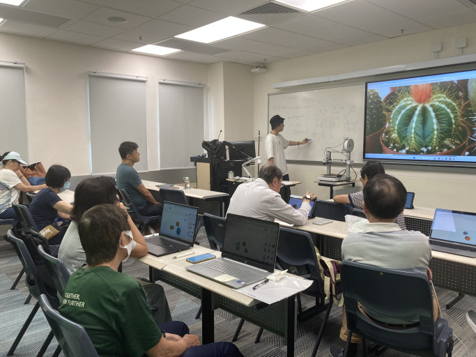 Instructor giving a presentation during a 3D design workshop.