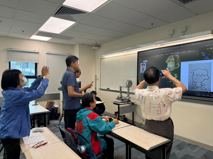  Participants photographing a 2D-to-3D character modeling demonstration on an interactive board.