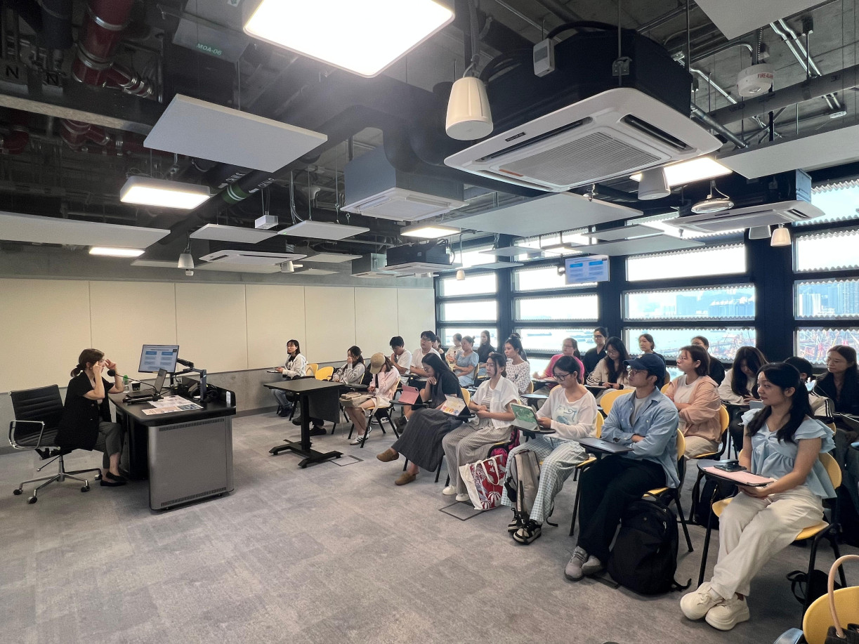Postgraduate students actively engaged, refining their academic writing skills.