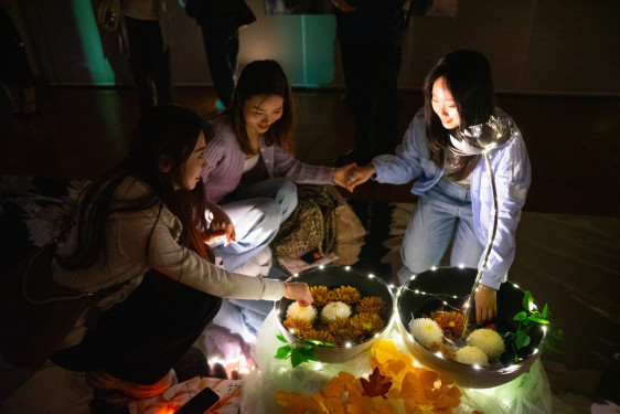 Students try out the installation together